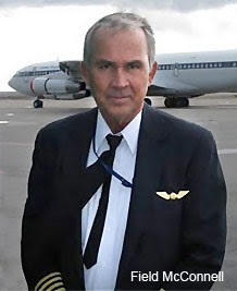 Field McConnell in front of an Aircraft in Pilot Dress