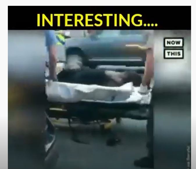 An image of a man on a stretcher.