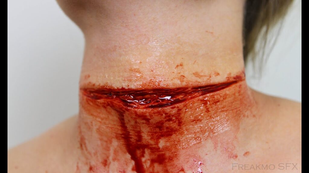 A woman's neck with blood on it.