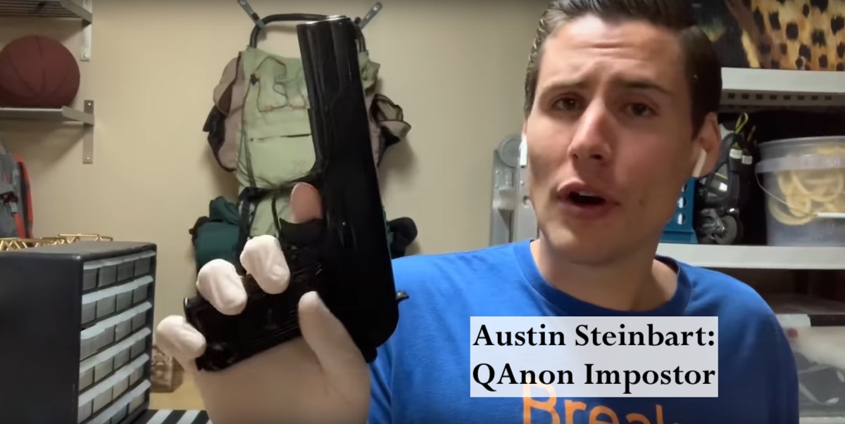 A man holding a gun with the words austin neihart qaon inspector.