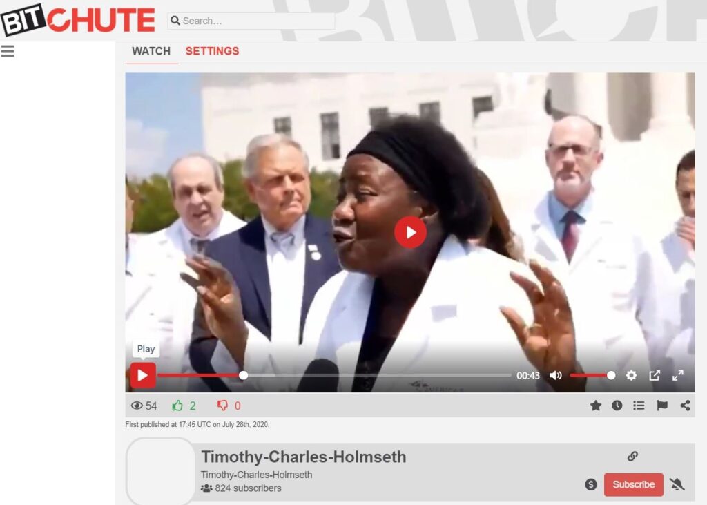 A screen shot of a video showing a woman in a white coat.
