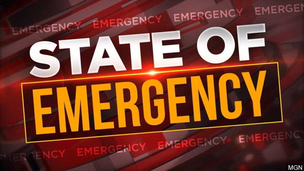 The state of emergency logo on a red background.