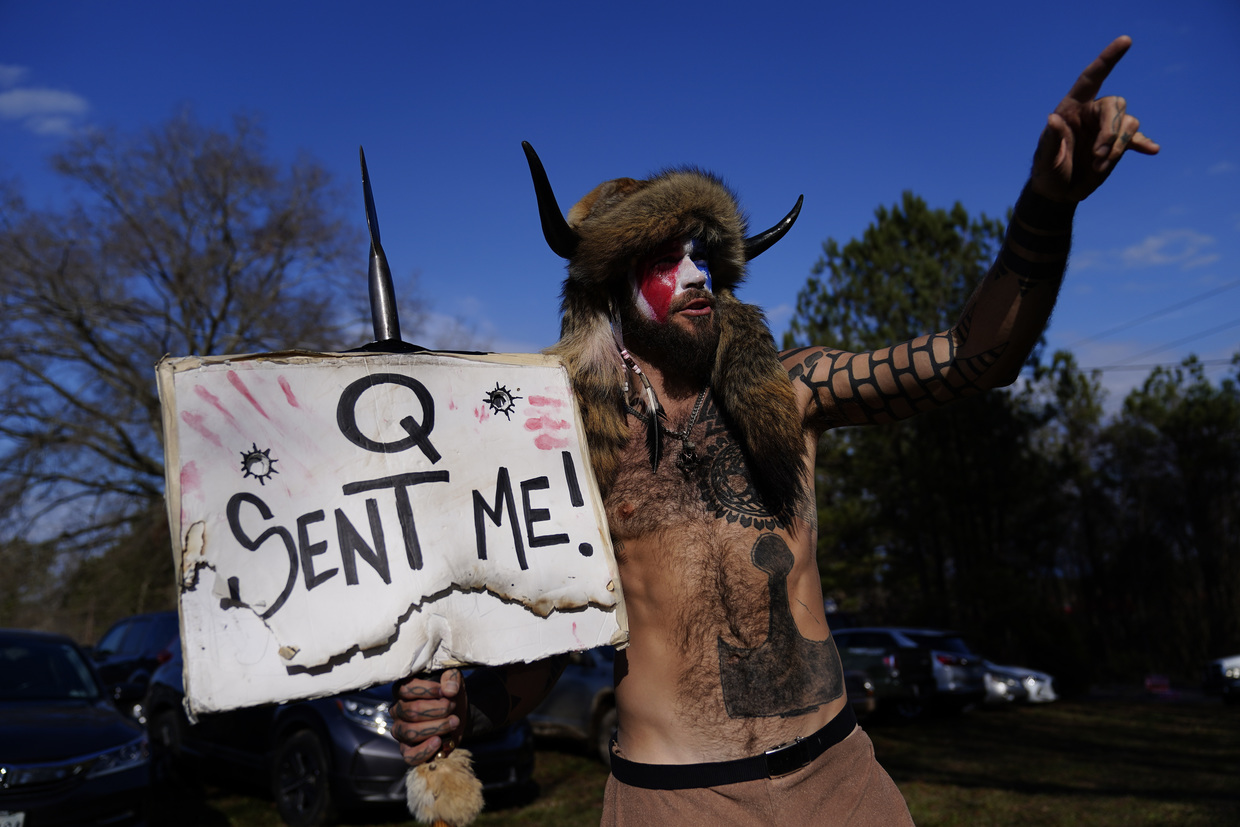 A man holding a sign that says'send me'.