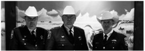 officer wearing a white cowboy hat