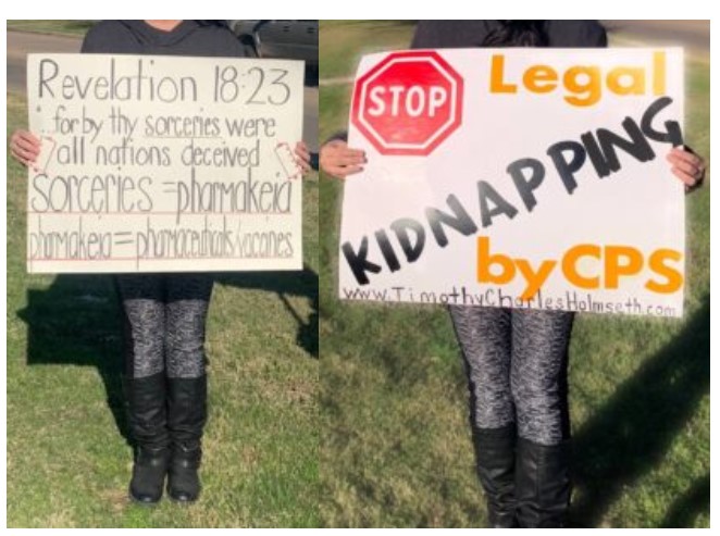 A woman holding a sign that says kidnapping by cps.
