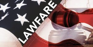 A gavel and an american flag with the word lawfare.