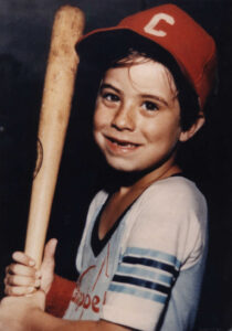 A young boy holding a baseball bat.