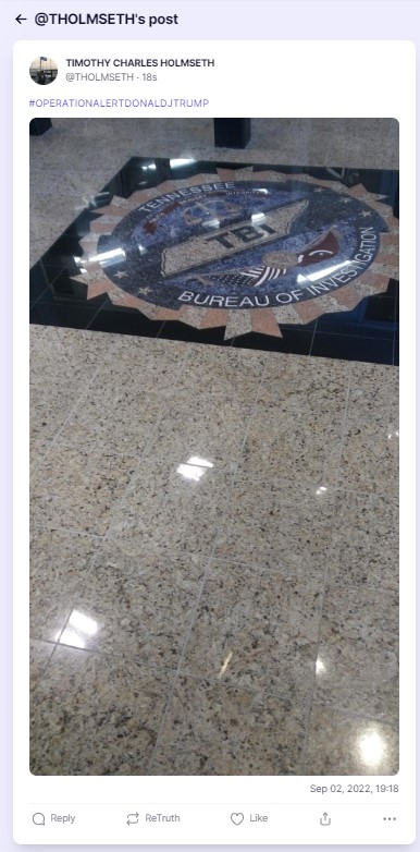 An image of the fbi seal on the floor of a building.