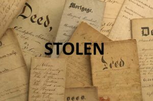 A pile of old documents with the words stolen on them.