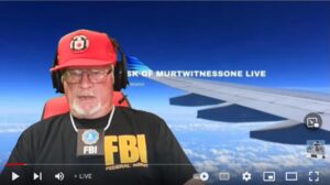 A video showing a person wearing an FBI shirt