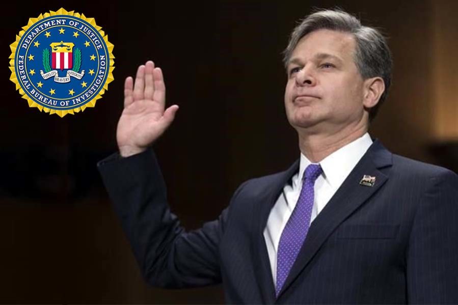 A Man in Suit Standing with Raised Hand and Logo of FBI