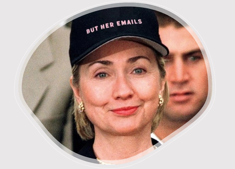 Hillary wearing a cap, smiling at the camera