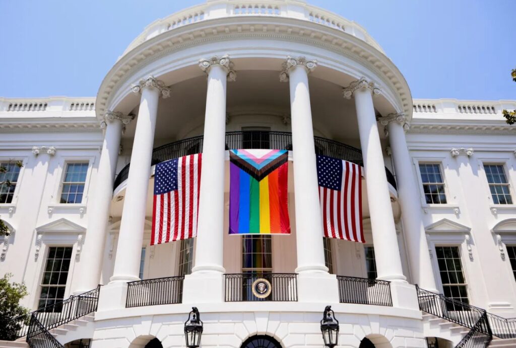 Outside image of a white house with flags