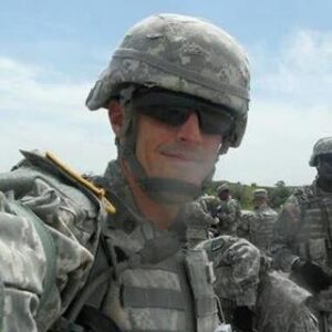 Close up shot of a solider smiling at the camera