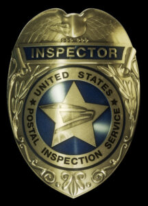A badge with the words inspector on it.