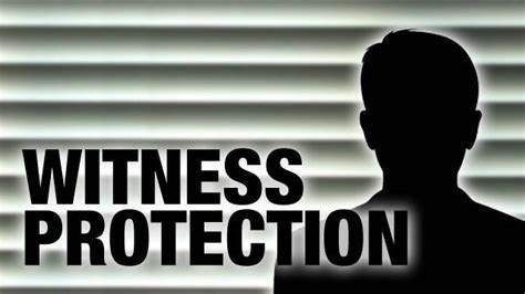 A silhouette of a man with the words witness protection.