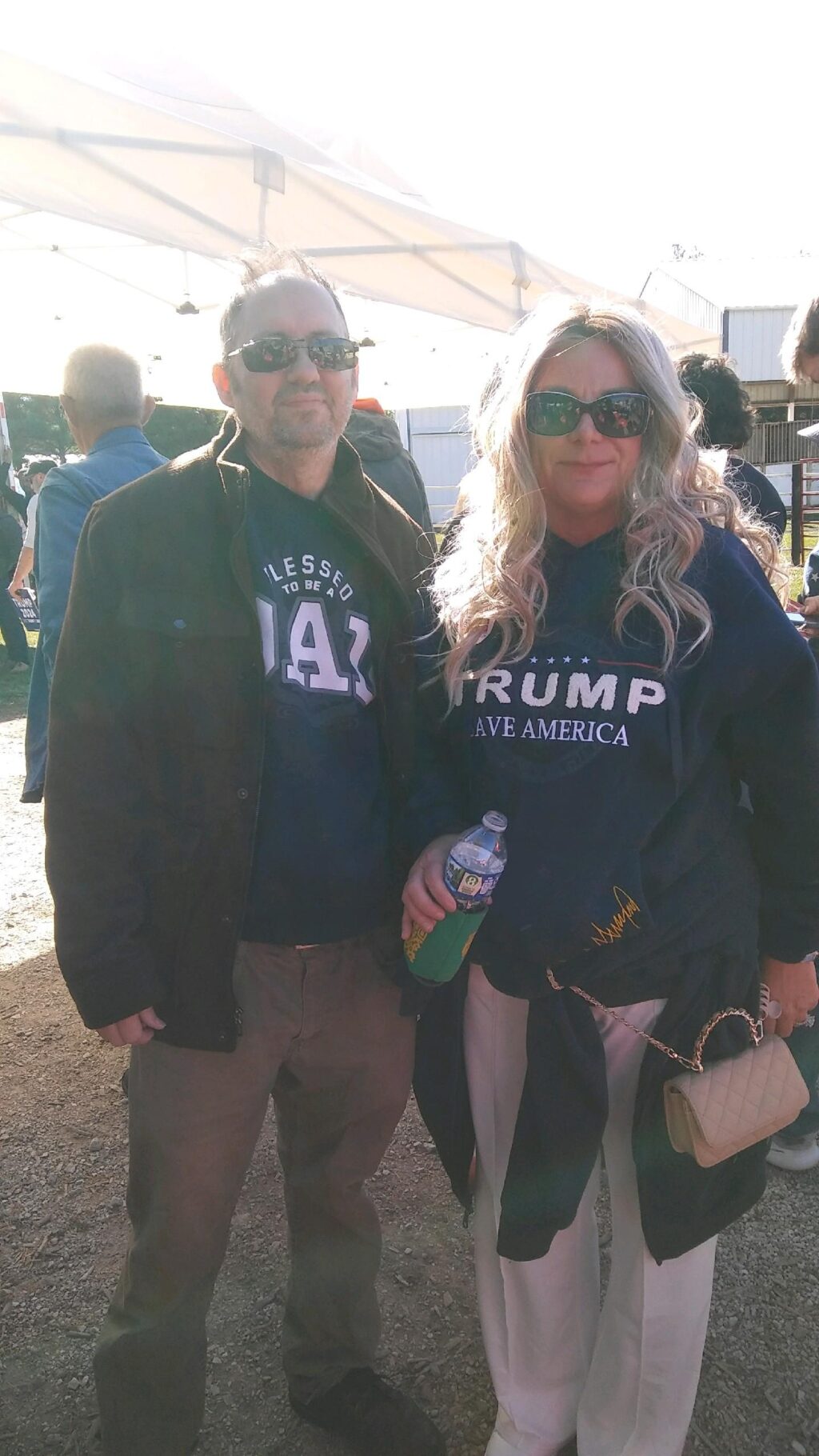 A man and woman standing next to each other at an event.