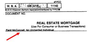 A real estate mortgage document with an arrow pointing to it.