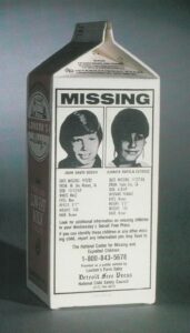 A milk carton with a picture of the beatles on it.
